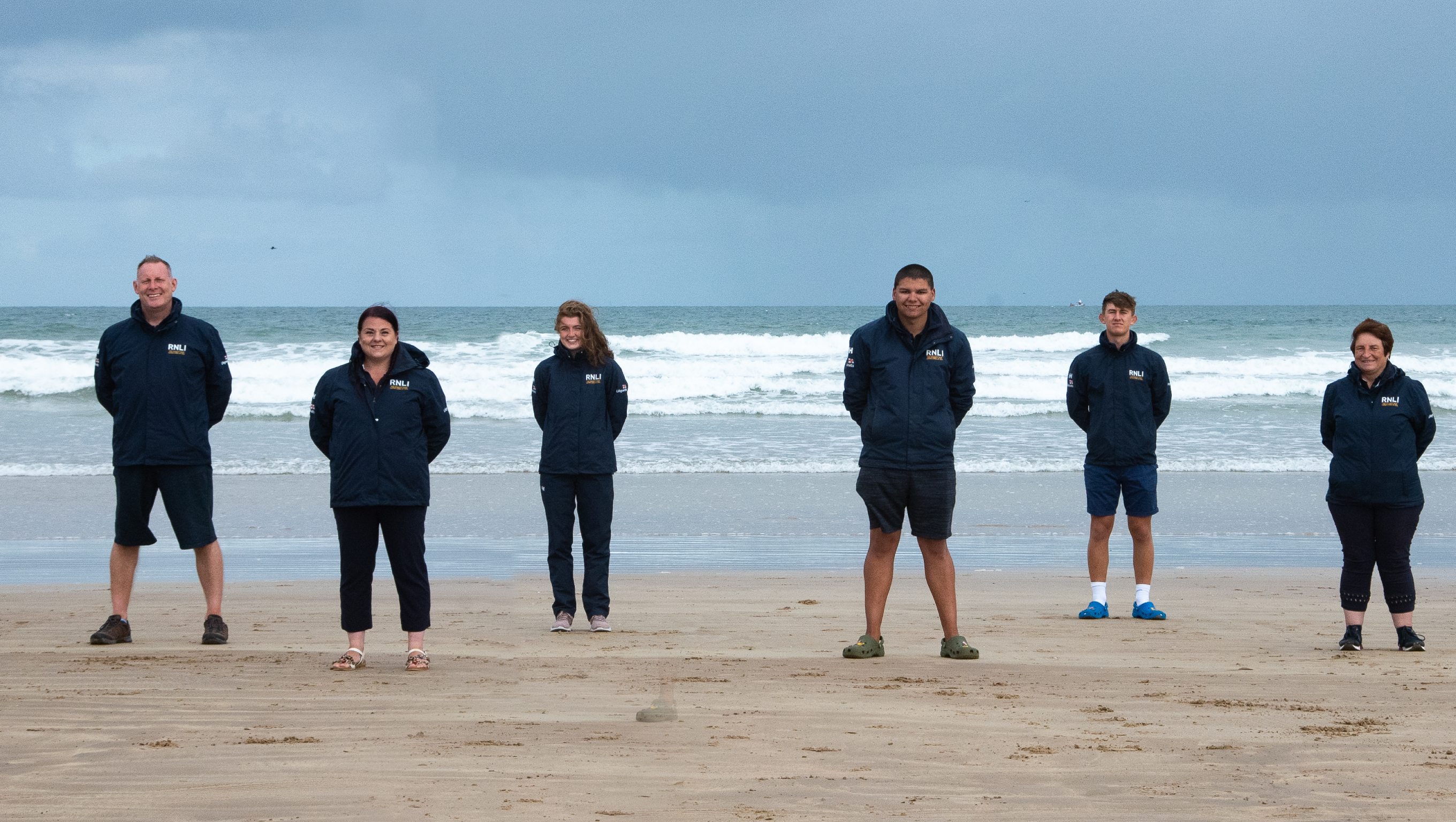 Group shot of RNLI Face to Face fundraisers at Portrush beach, Northern Ireland.